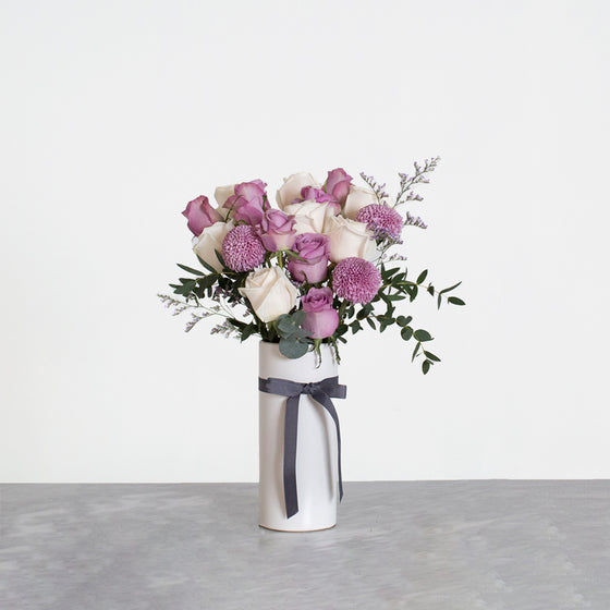 Mauve flower and vase